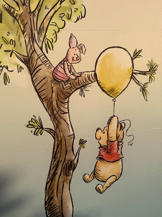 Bear on a balloon arch