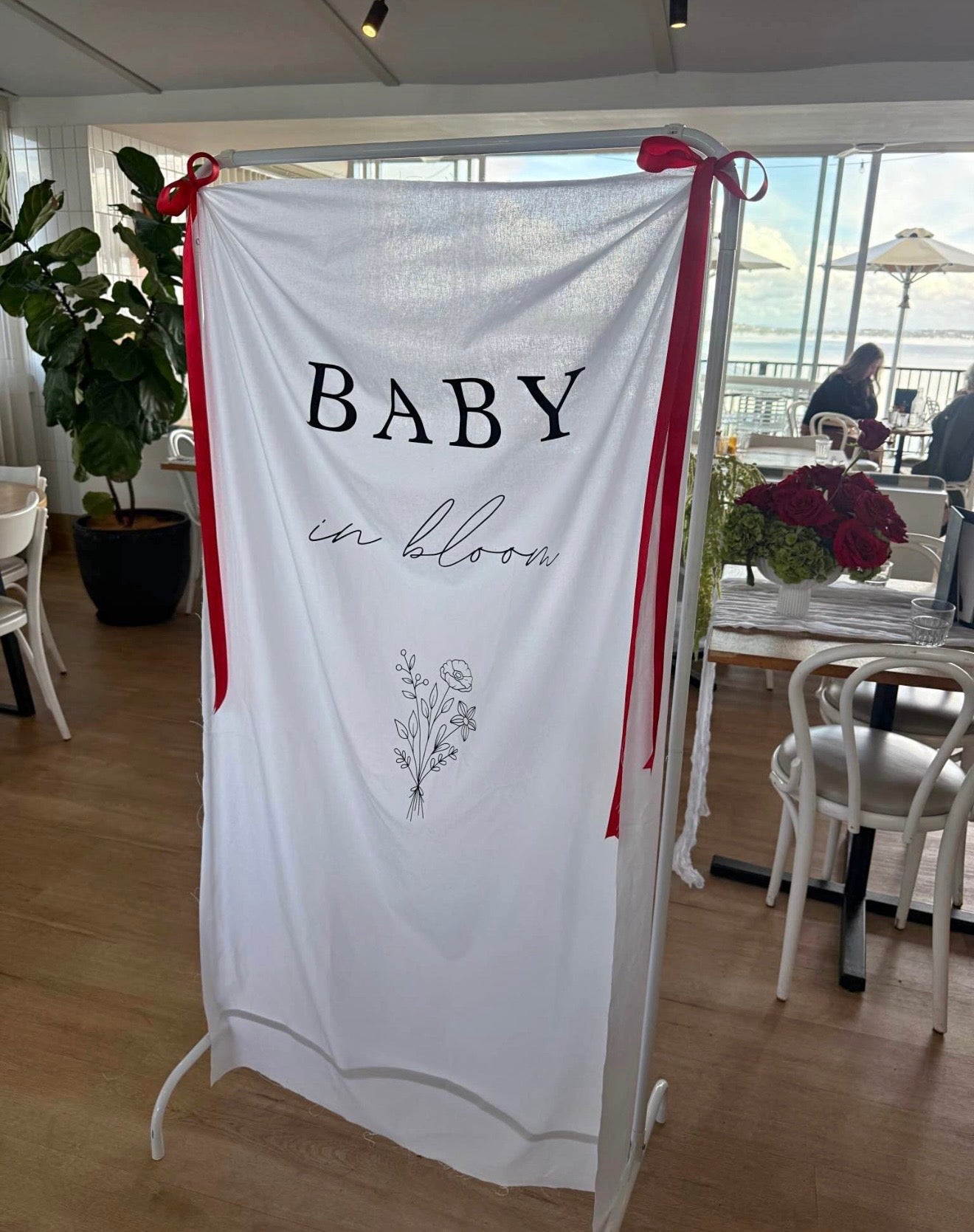 Baby in bloom linen sign and white frame